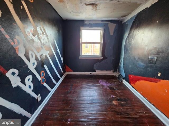 8305 Temple Road Philadelphia, PA 19150 - Photo 9 of 14 a view of an empty room with wooden floor and a window