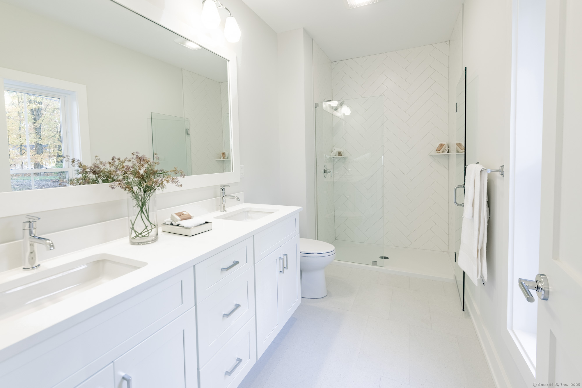 3 Pine Ridge, Unit 23 Middlebury, CT 06762 - Photo 14 of 28 a bathroom with a double vanity sink toilet and shower