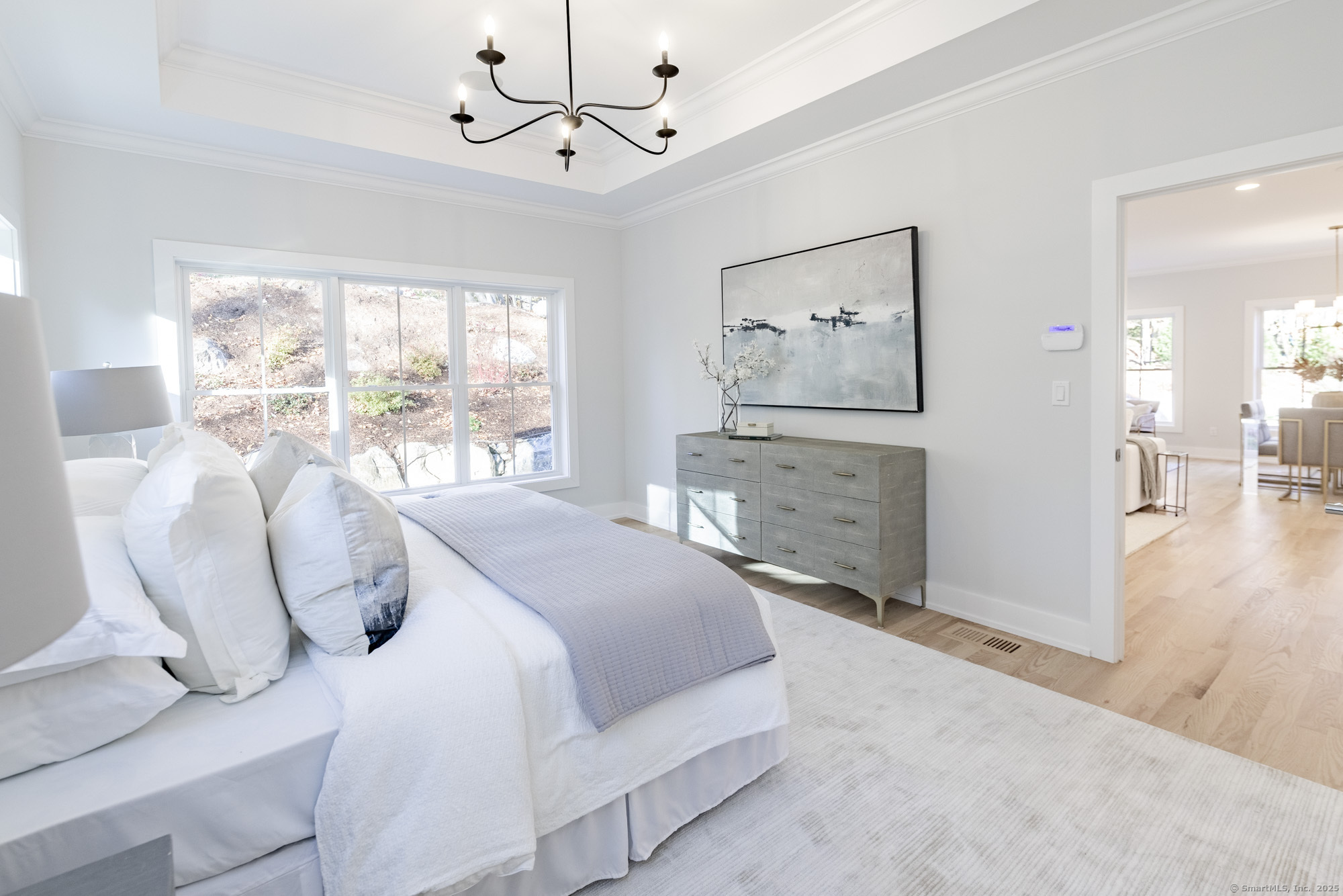 3 Pine Ridge, Unit 23 Middlebury, CT 06762 - Photo 23 of 28 a bedroom with a large bed and a large window
