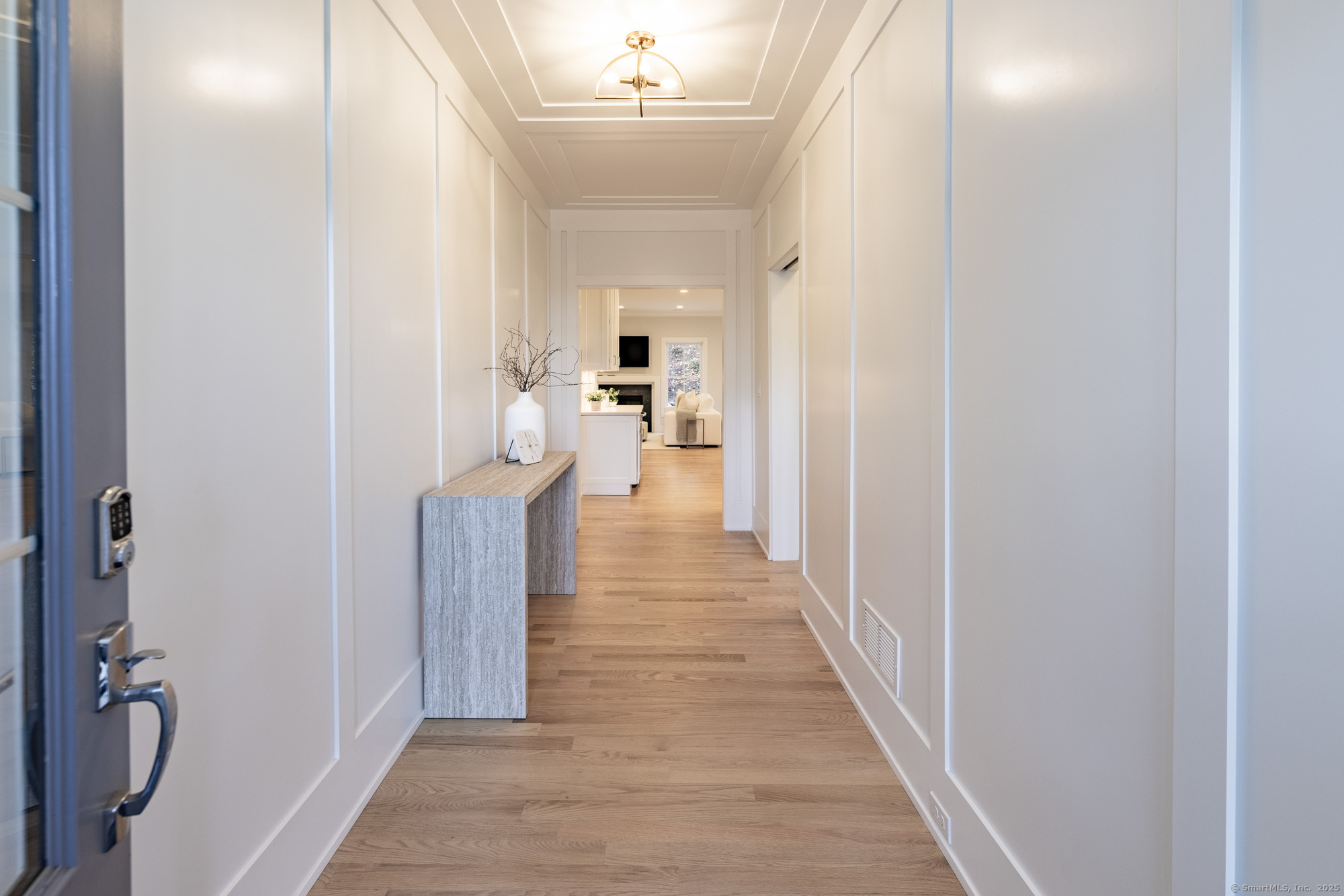 3 Pine Ridge, Unit 23 Middlebury, CT 06762 - Photo 28 of 28 a view of a hallway with wooden floor and furniture