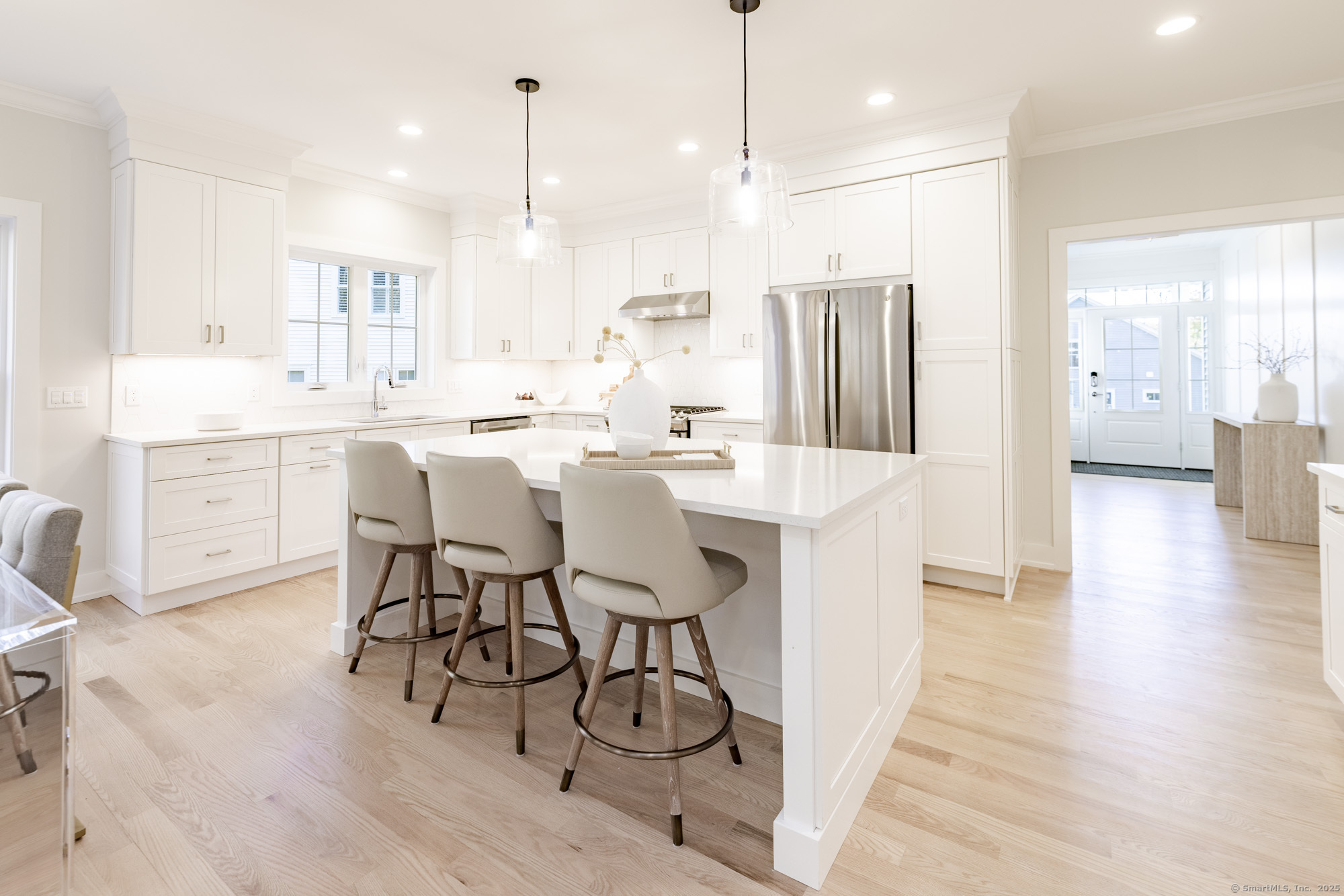 3 Pine Ridge, Unit 23 Middlebury, CT 06762 - Photo 5 of 28 a large kitchen with a table and chairs