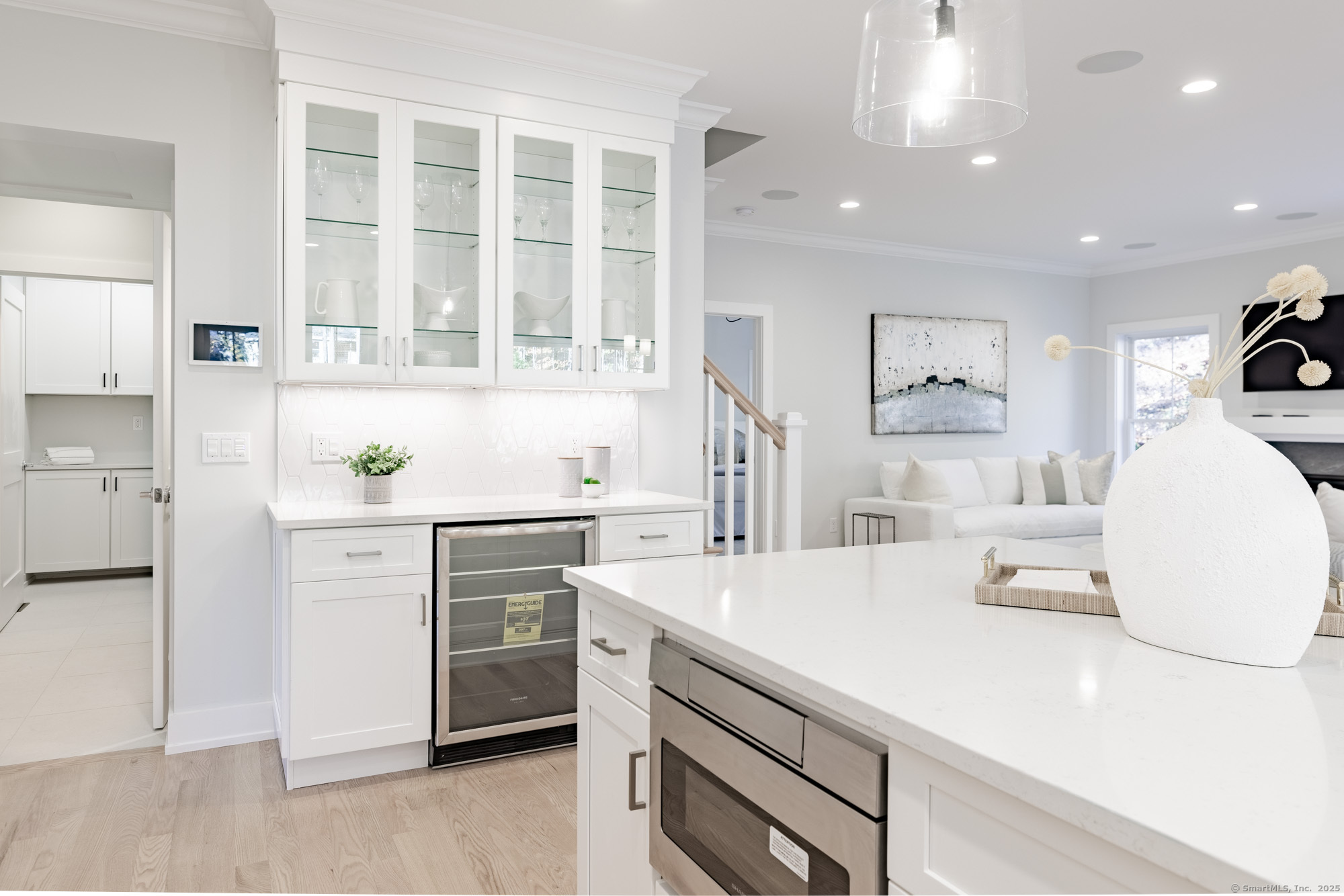3 Pine Ridge, Unit 23 Middlebury, CT 06762 - Photo 6 of 28 a kitchen with white cabinets and stainless steel appliances