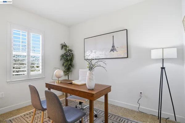 a large bathroom with a double vanity sink a large mirror and a bathtub