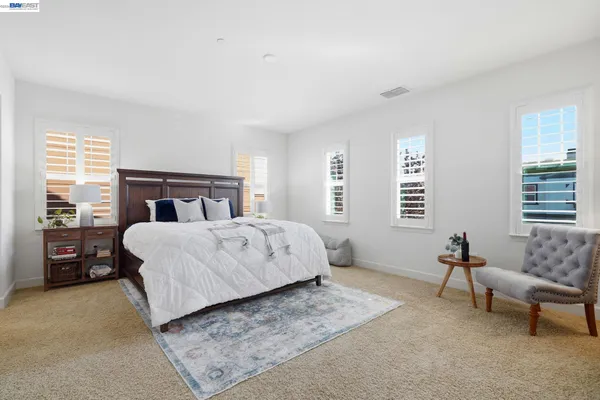 a bath tub sitting in a bathroom next to a window