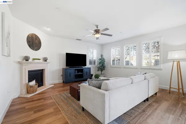a kitchen with stainless steel appliances granite countertop a sink a stove and cabinets