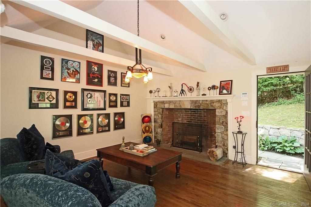 22 Ketcham Road Ridgefield, CT 06877 - Photo 39 of 40 a living room with furniture large window and fireplace