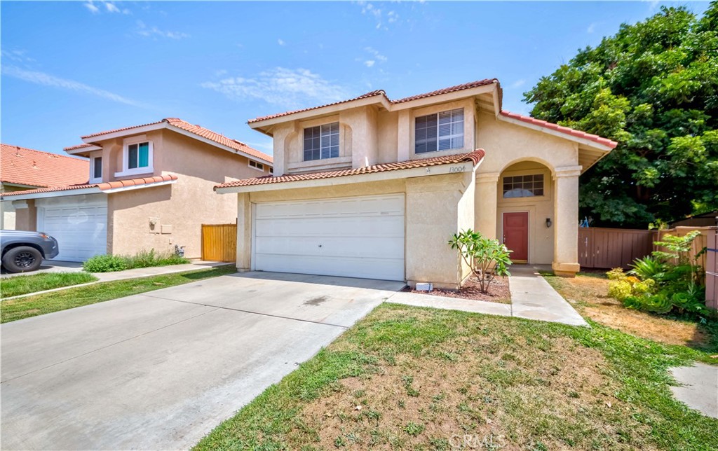 13004 Winter Sun Way Riverside, CA 92503 - Photo 1 of 1 a front view of a house with a yard and a garage