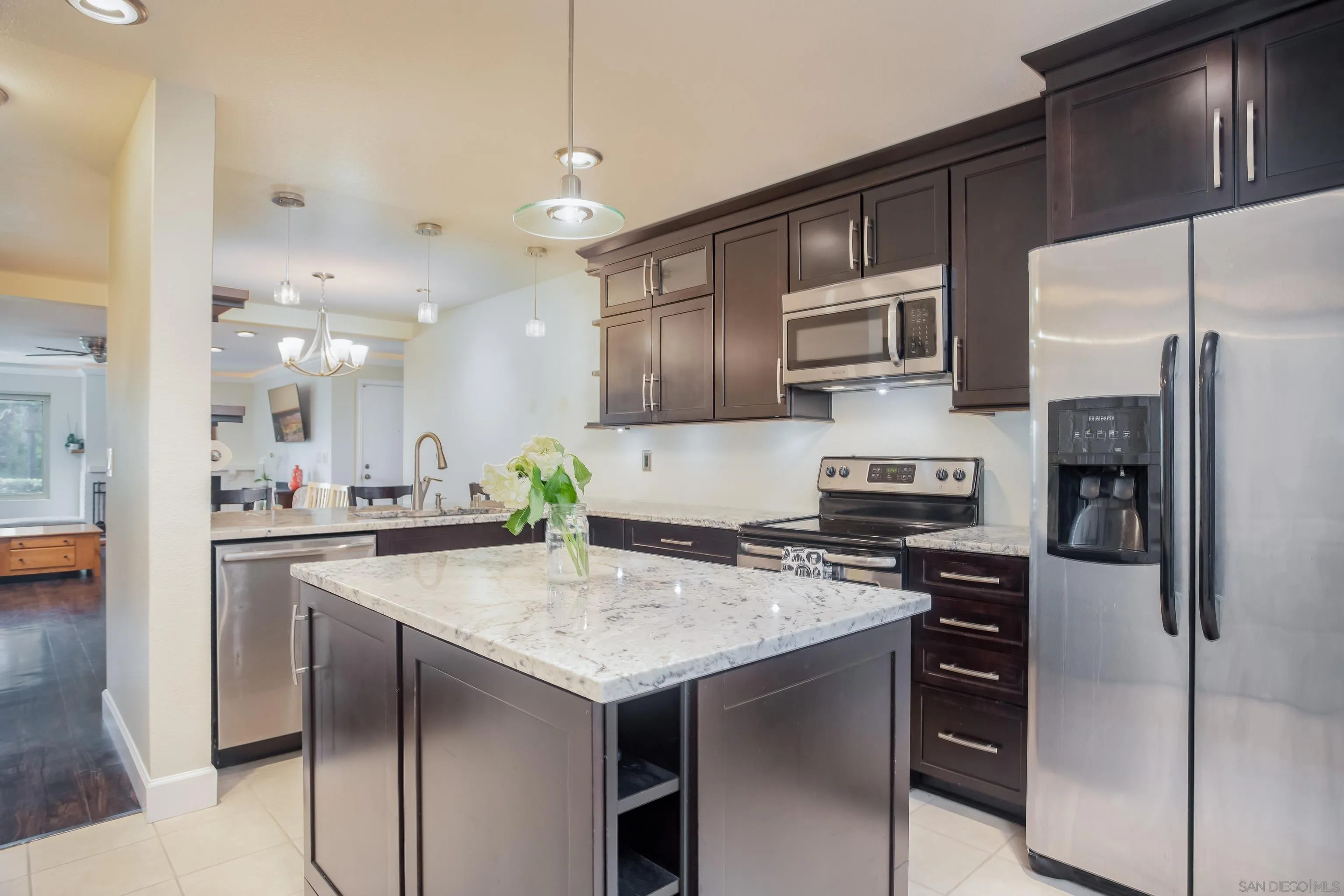 6345 Rancho Mission Road, Unit 3 San Diego, CA 92108 - Photo 1 of 43 a kitchen with a sink stainless steel appliances and white cabinets