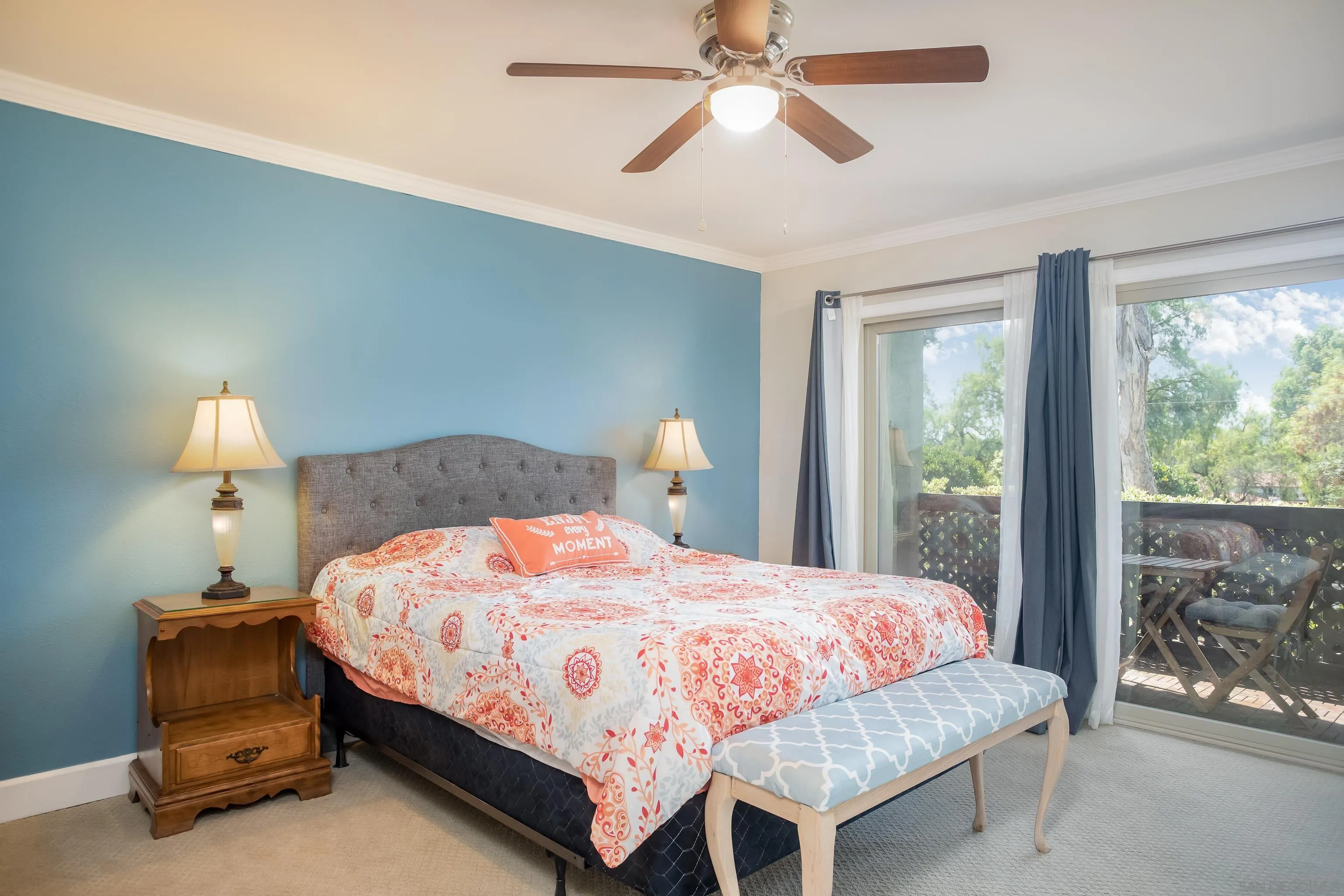 6345 Rancho Mission Road, Unit 3 San Diego, CA 92108 - Photo 18 of 43 a bedroom with a bed and a chandelier