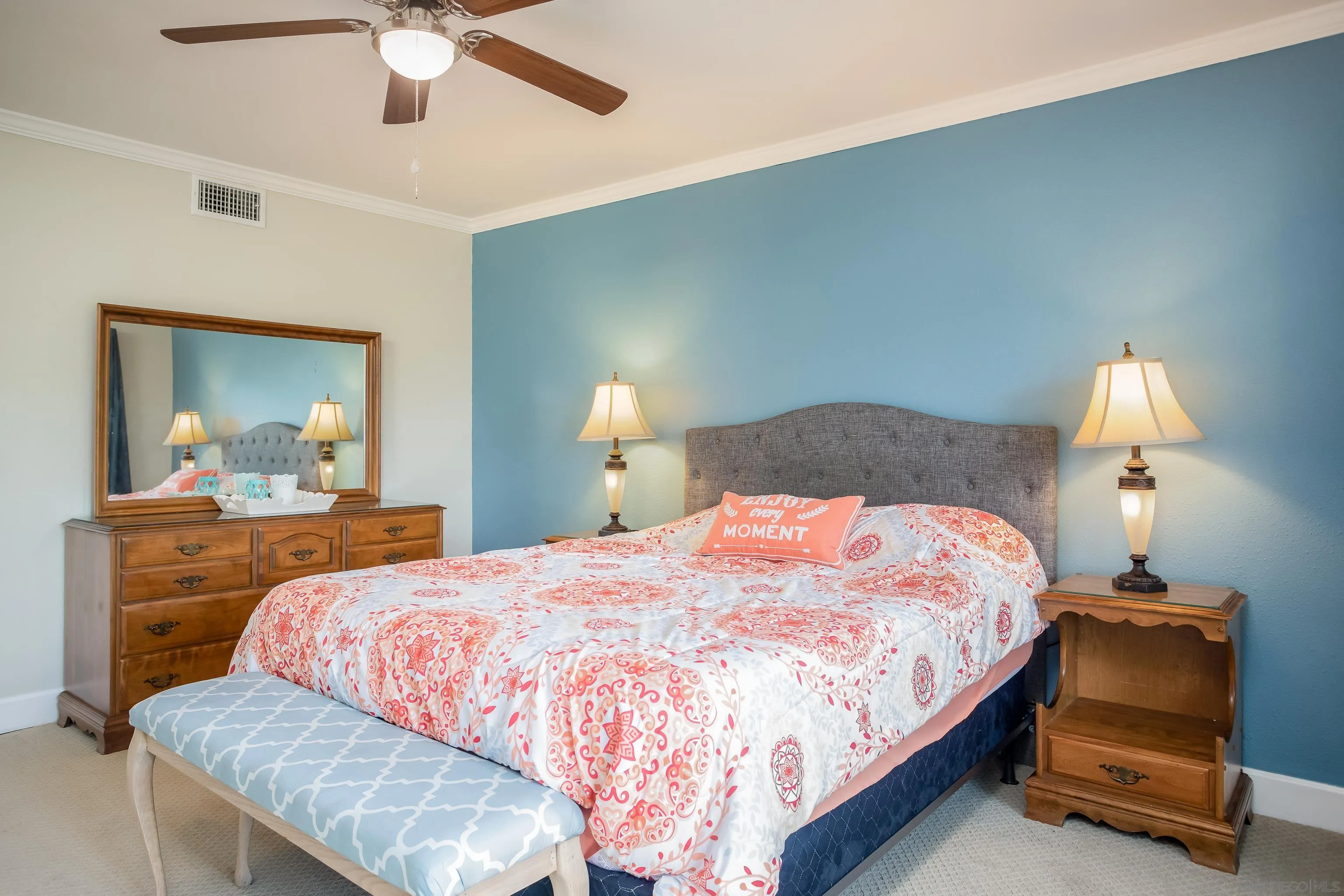 6345 Rancho Mission Road, Unit 3 San Diego, CA 92108 - Photo 19 of 43 a bedroom with a bed and a chandelier