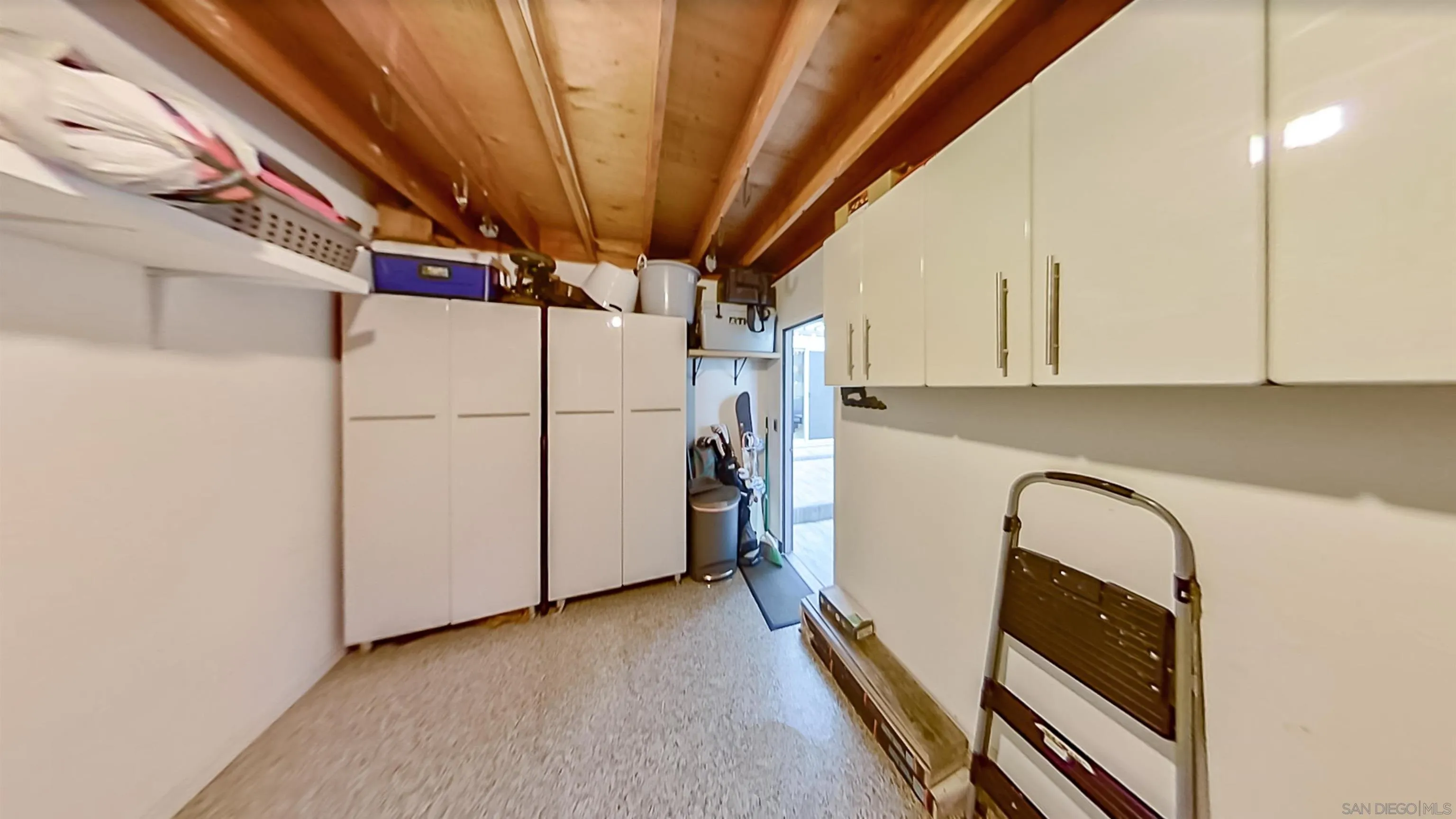 6345 Rancho Mission Road, Unit 3 San Diego, CA 92108 - Photo 32 of 43 a view of a storage and utility room with washer and dryer