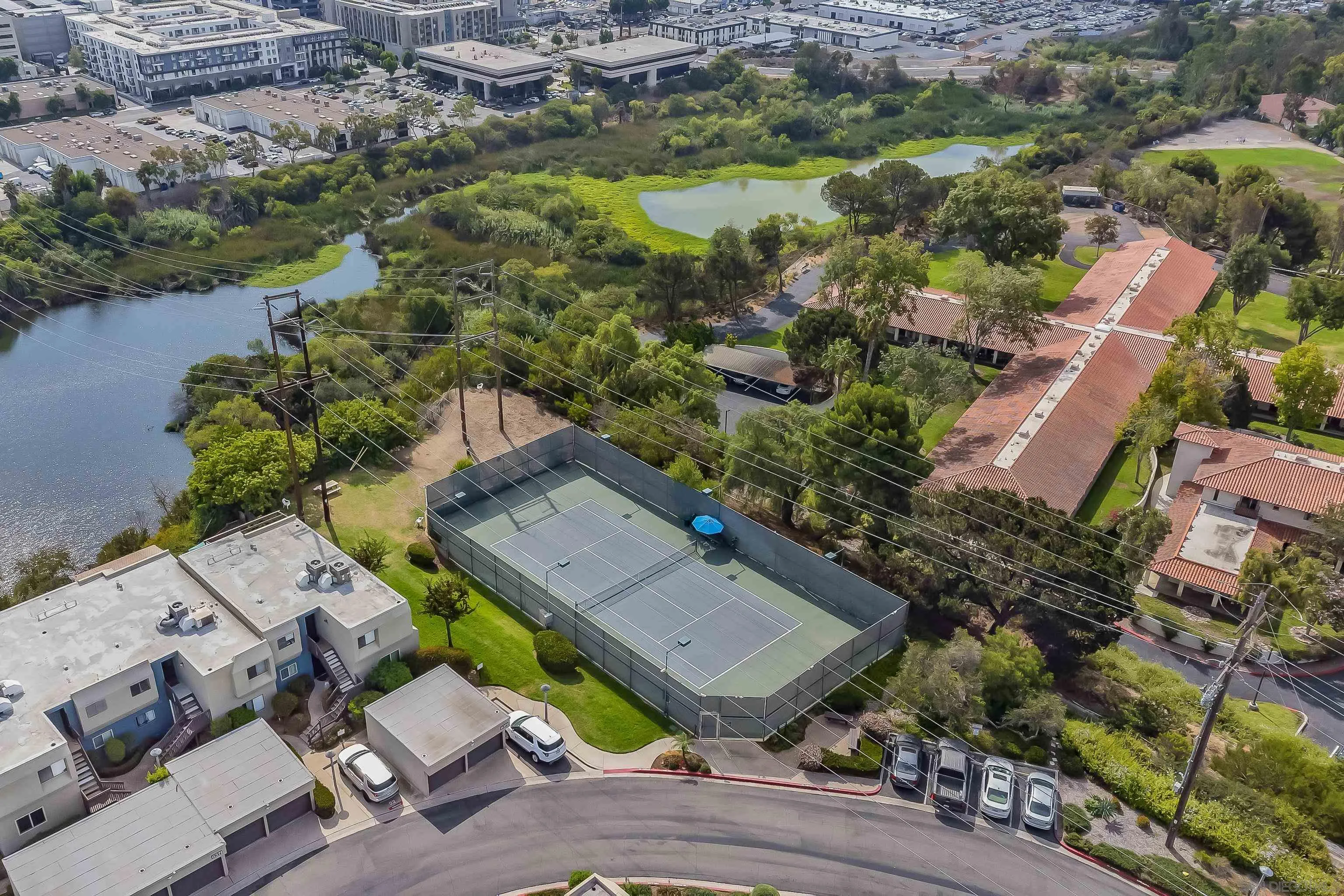 6345 Rancho Mission Road, Unit 3 San Diego, CA 92108 - Photo 37 of 43 an aerial view of residential house with outdoor space and lake view