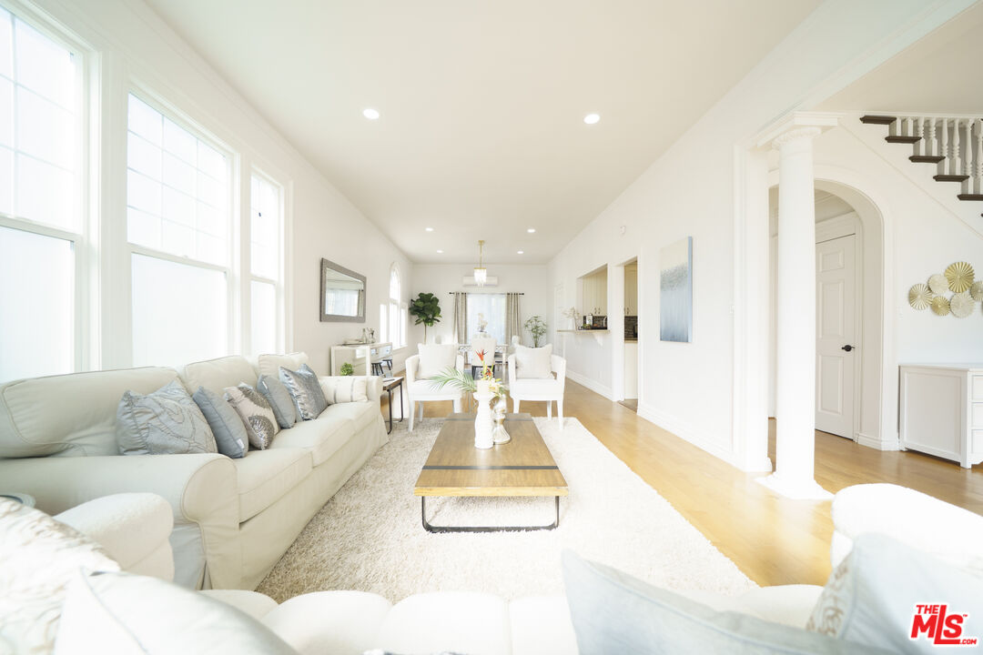 1159 South Norton Avenue Los Angeles, CA 90019 - Photo 11 of 39 a living room with furniture and a large window