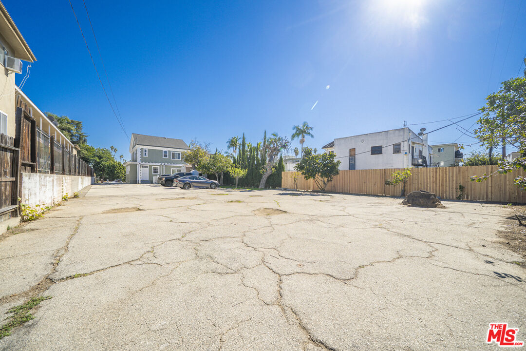 1159 South Norton Avenue Los Angeles, CA 90019 - Photo 38 of 39 a view of road with a house in the background