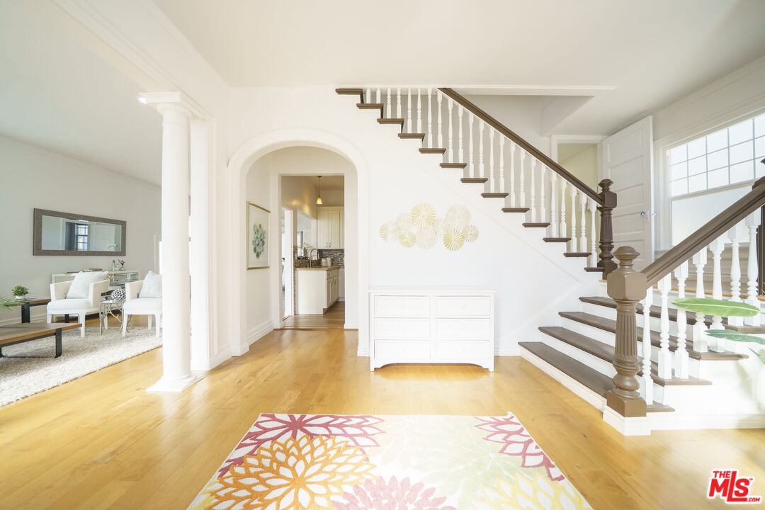 1159 South Norton Avenue Los Angeles, CA 90019 - Photo 9 of 39 a view of entryway and hall with wooden floor