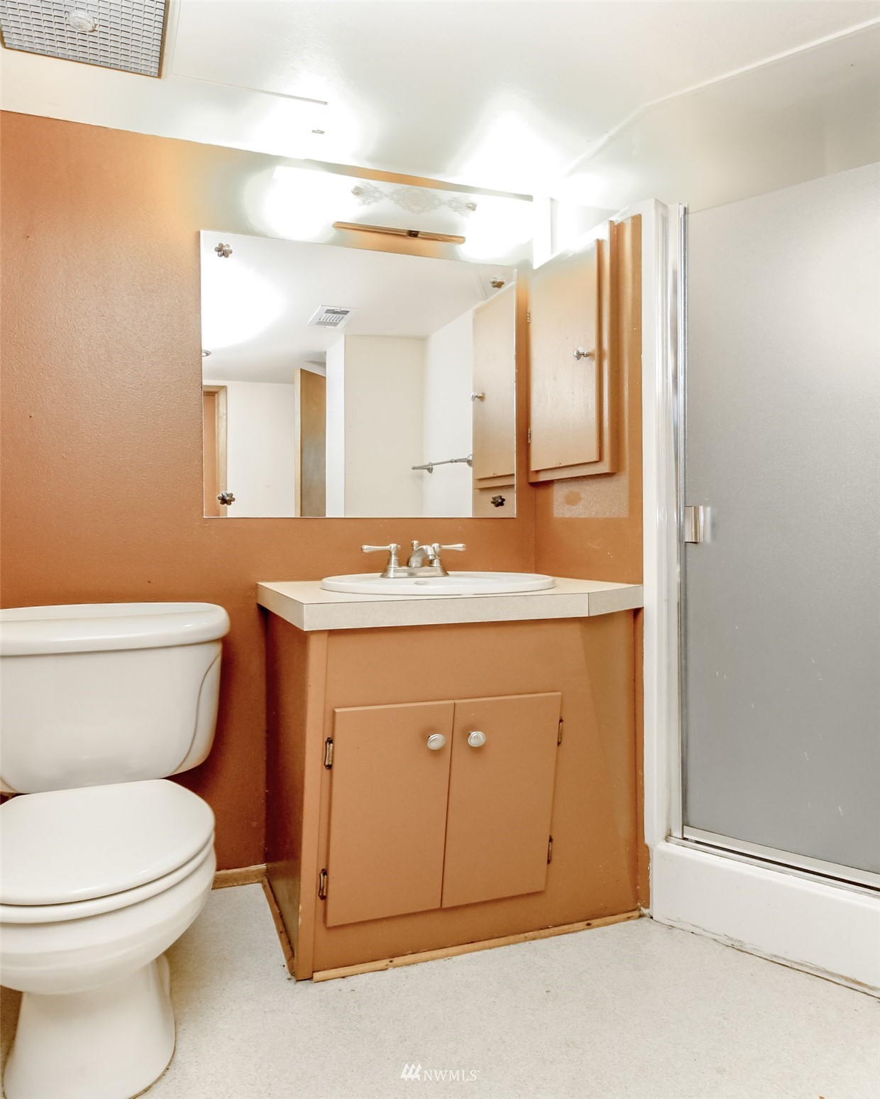 12011 Southeast 157th Place Renton, WA 98058 - Photo 13 of 40 a bathroom with a sink and a toilet