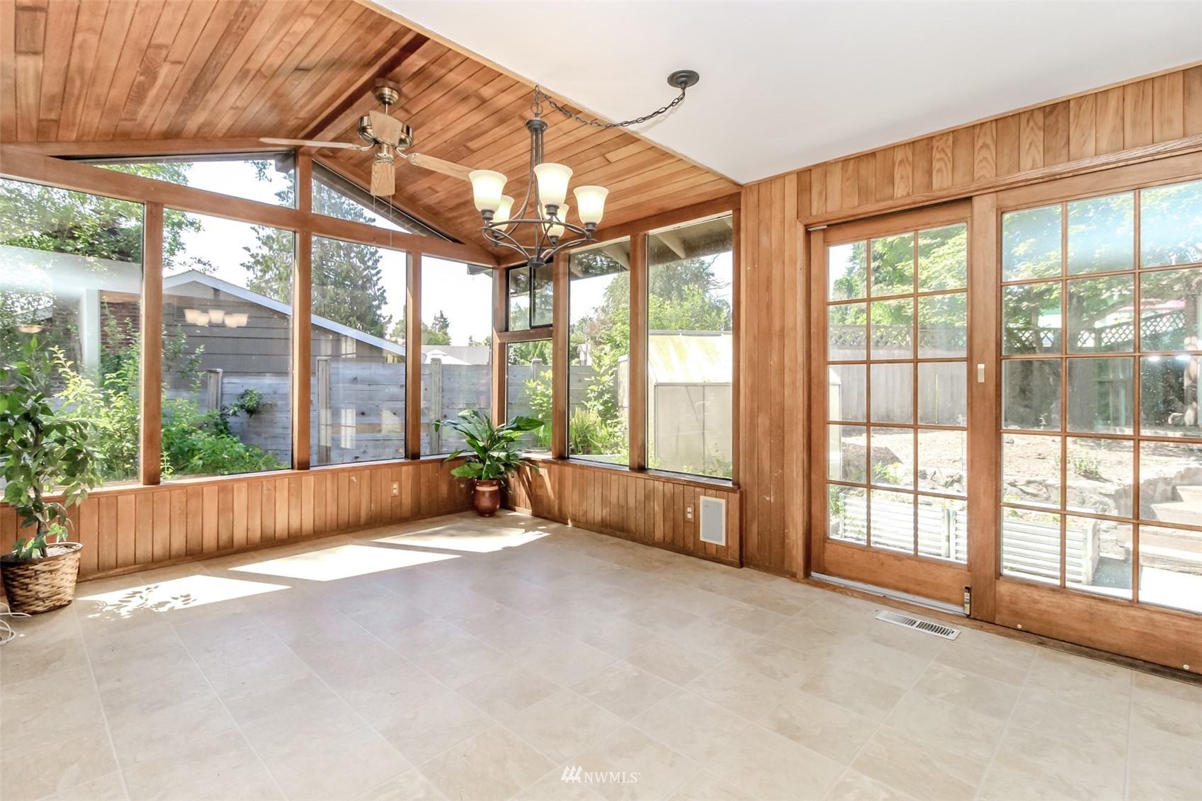 12011 Southeast 157th Place Renton, WA 98058 - Photo 26 of 40 a living room with furniture and a garden view