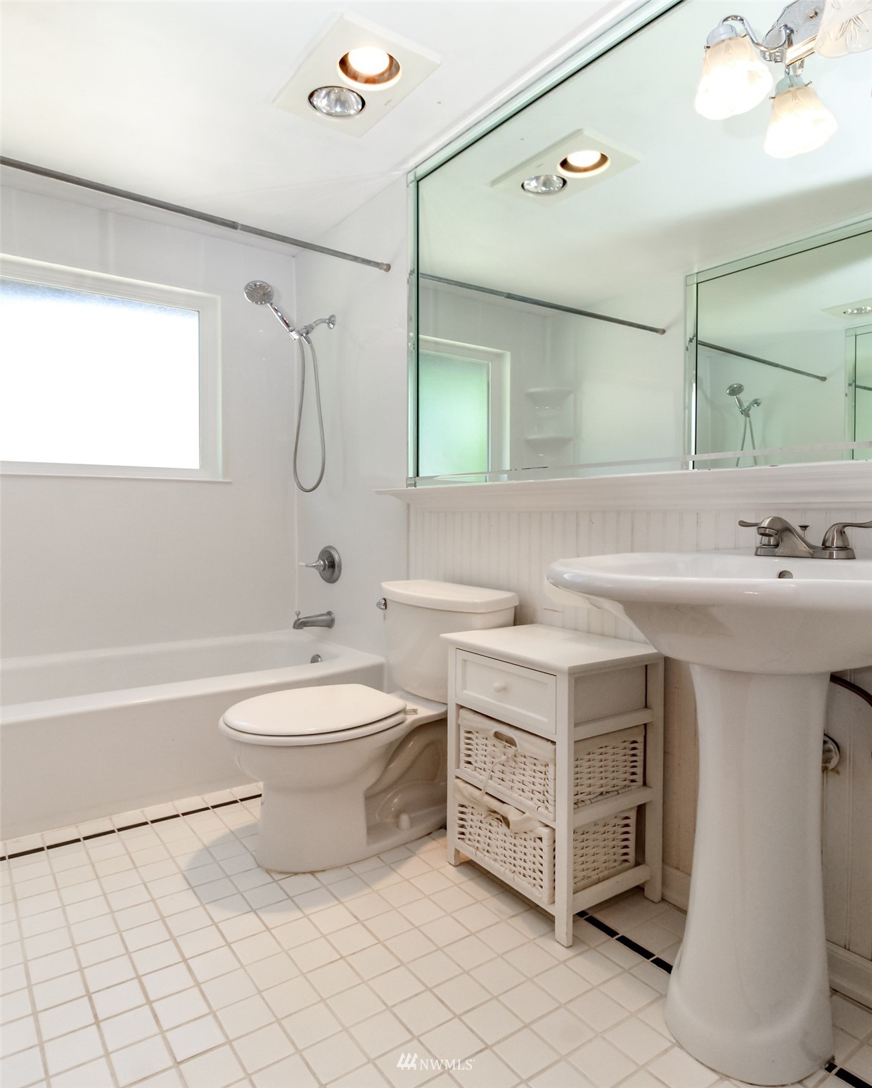 12011 Southeast 157th Place Renton, WA 98058 - Photo 34 of 40 a bathroom with a sink toilet a mirror and shower