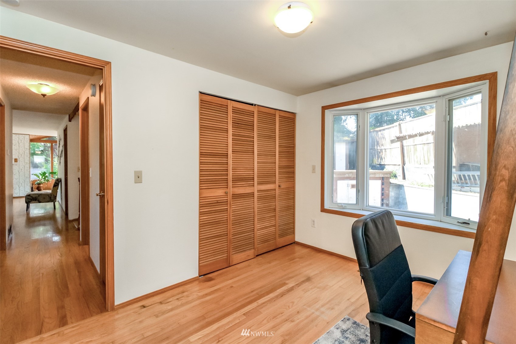 12011 Southeast 157th Place Renton, WA 98058 - Photo 37 of 40 a bedroom with a bed and a window