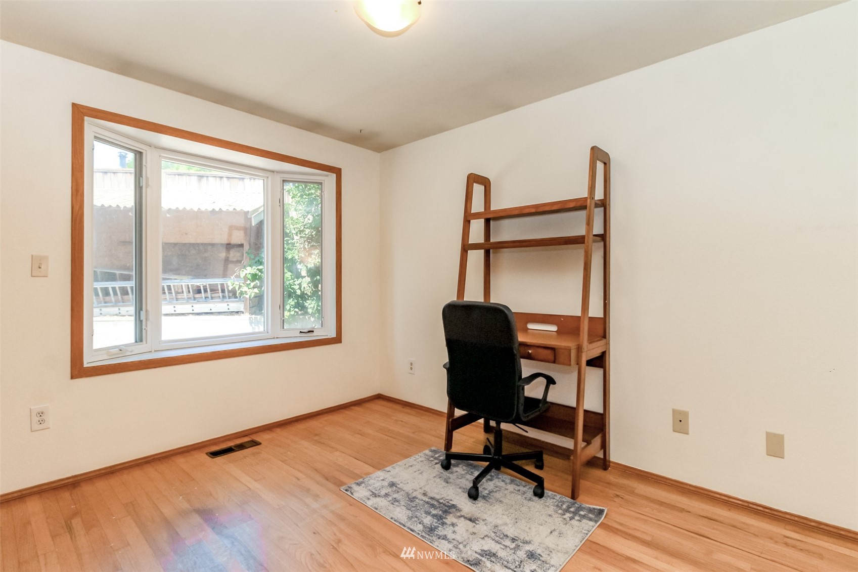 12011 Southeast 157th Place Renton, WA 98058 - Photo 38 of 40 a view of a workspace with furniture and a window