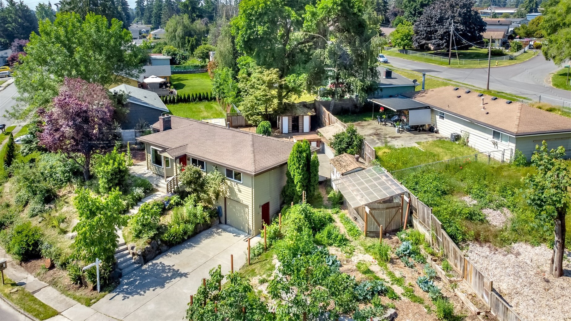 12011 Southeast 157th Place Renton, WA 98058 - Photo 10 of 40 an aerial view of a house with garden space and street view