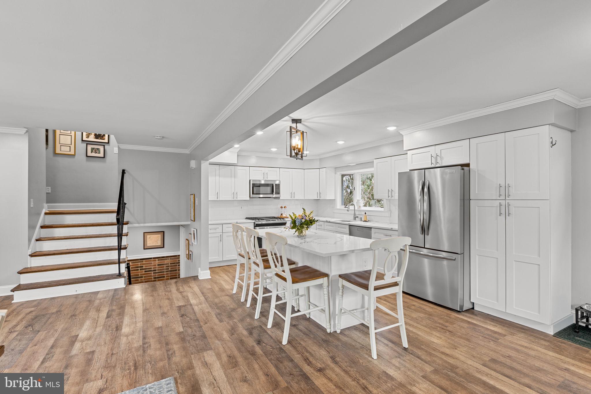 237 Waterloo Avenue Berwyn, PA 19312 - Photo 12 of 58 a view of a dining room with furniture a rug and wooden floor