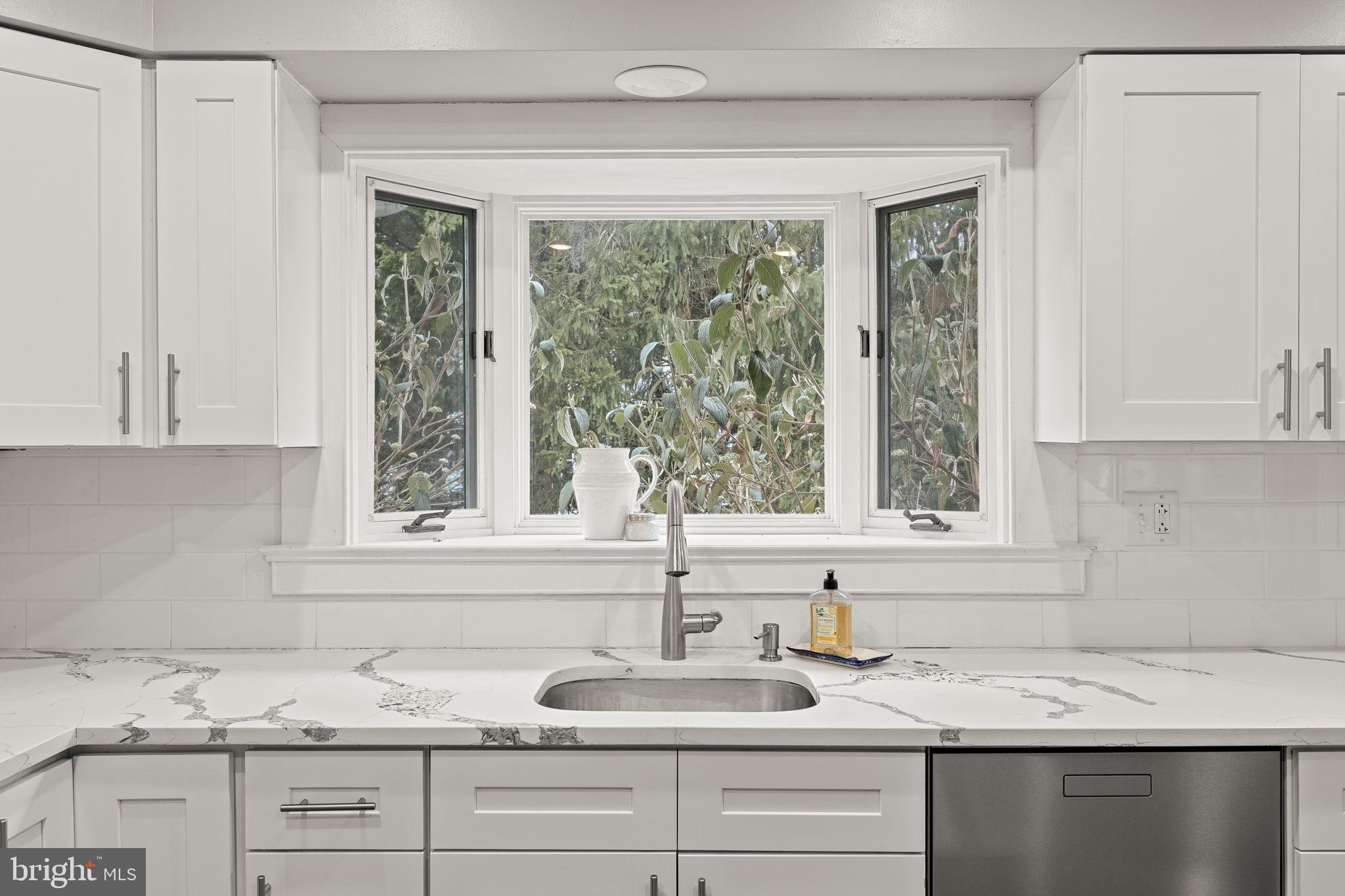 237 Waterloo Avenue Berwyn, PA 19312 - Photo 18 of 58 a kitchen with granite countertop a sink and a window