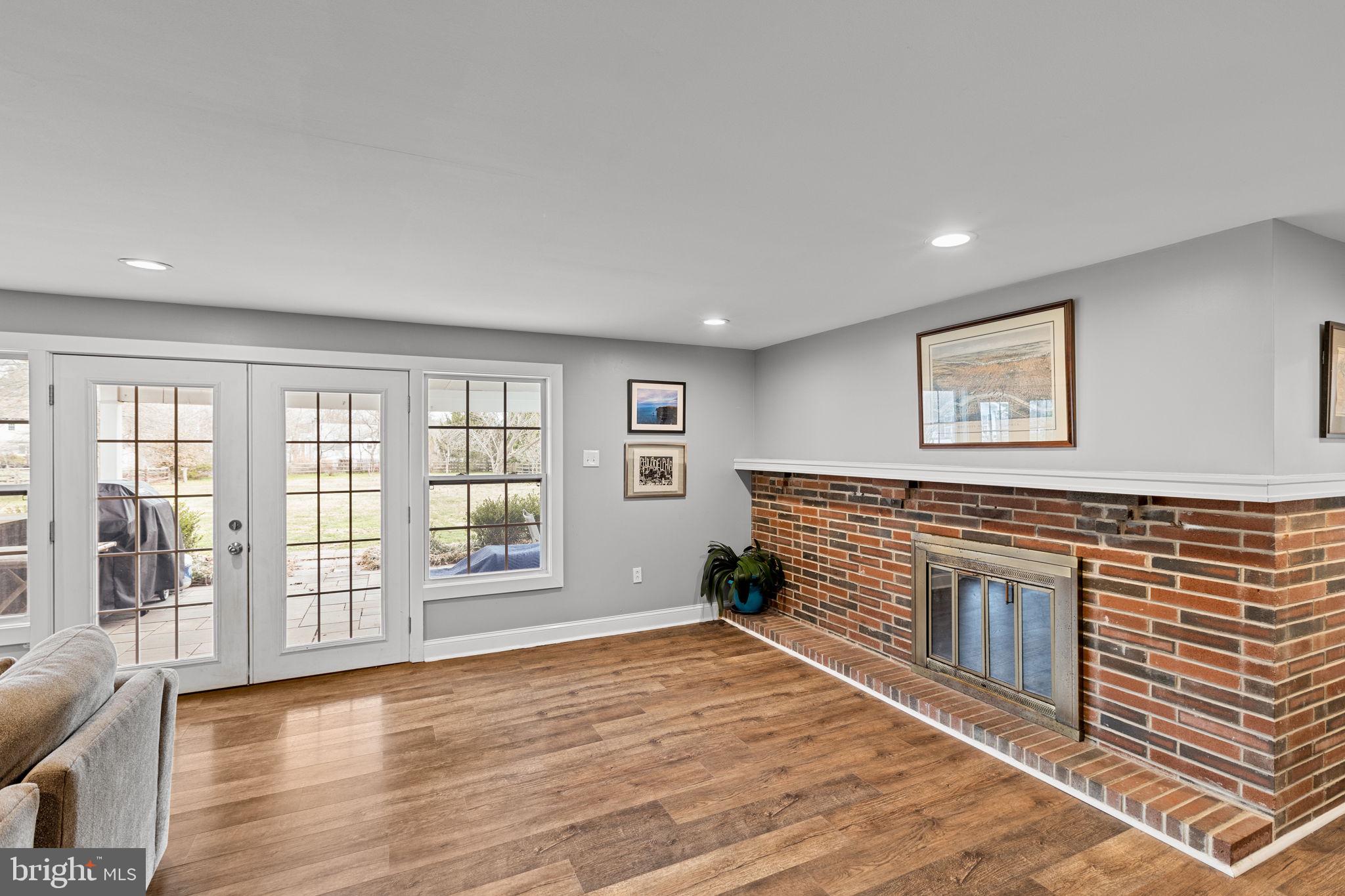 237 Waterloo Avenue Berwyn, PA 19312 - Photo 20 of 58 a view of an empty room with a window and wooden floor