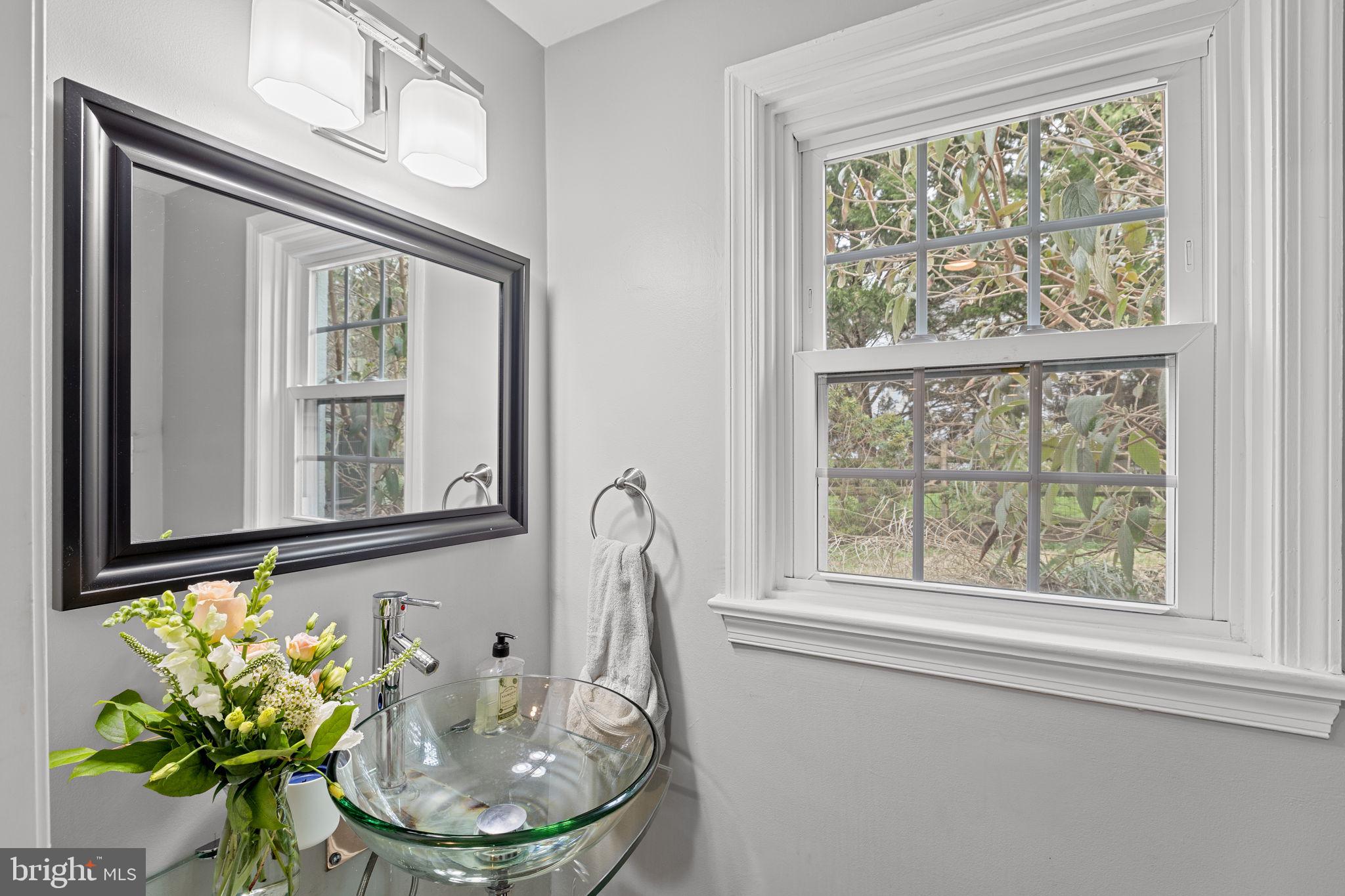 237 Waterloo Avenue Berwyn, PA 19312 - Photo 30 of 58 a bathroom with a granite countertop sink and a mirror