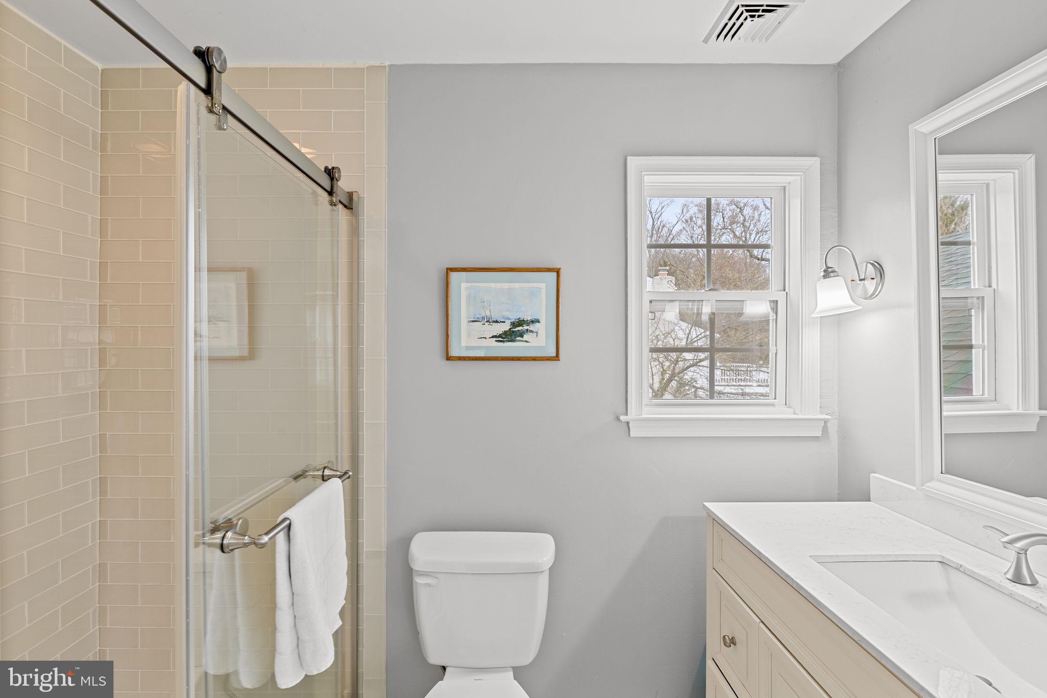 237 Waterloo Avenue Berwyn, PA 19312 - Photo 36 of 58 a bathroom with a sink toilet and window