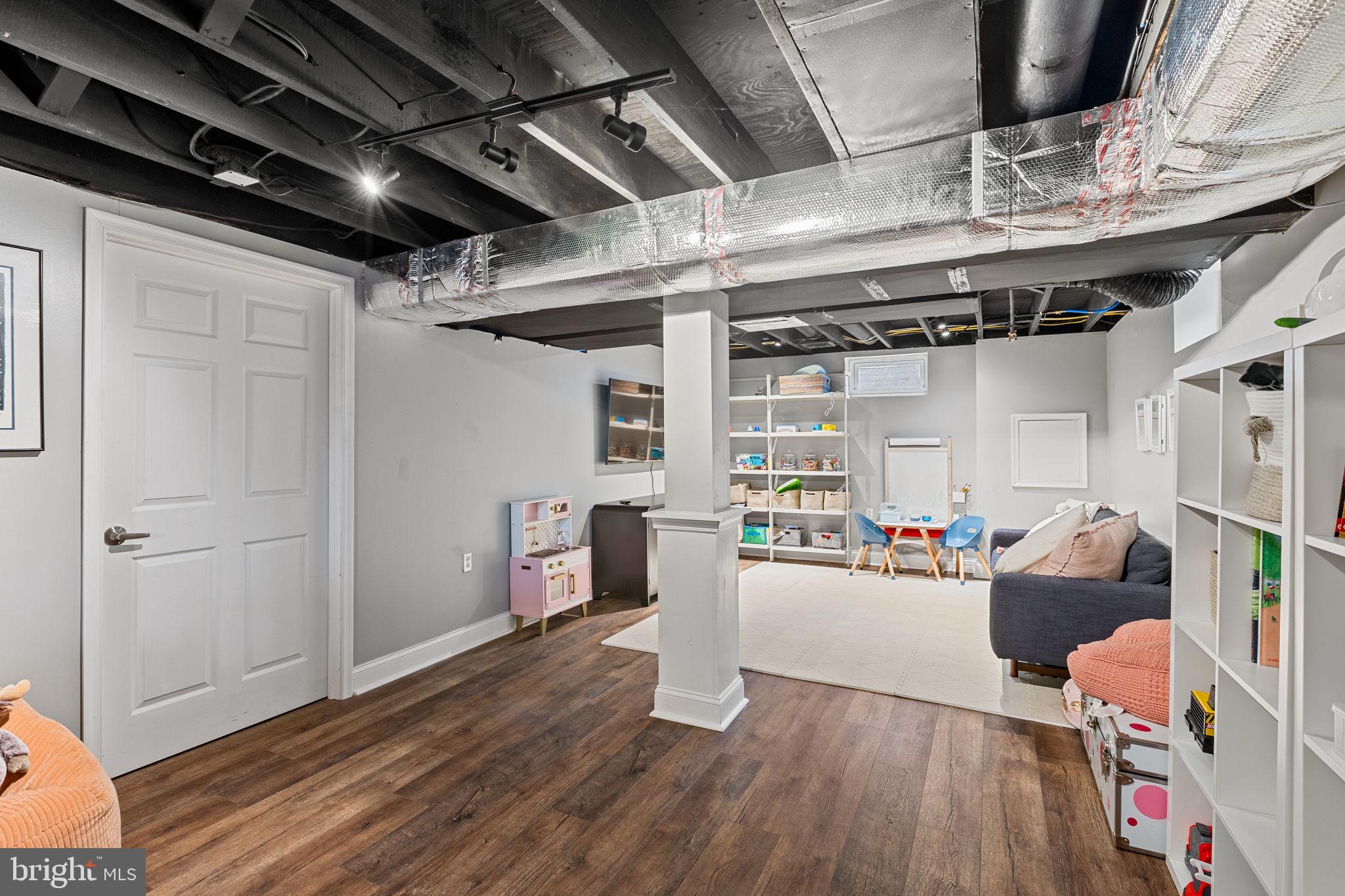 237 Waterloo Avenue Berwyn, PA 19312 - Photo 47 of 58 a view of a room with wooden floor and furniture