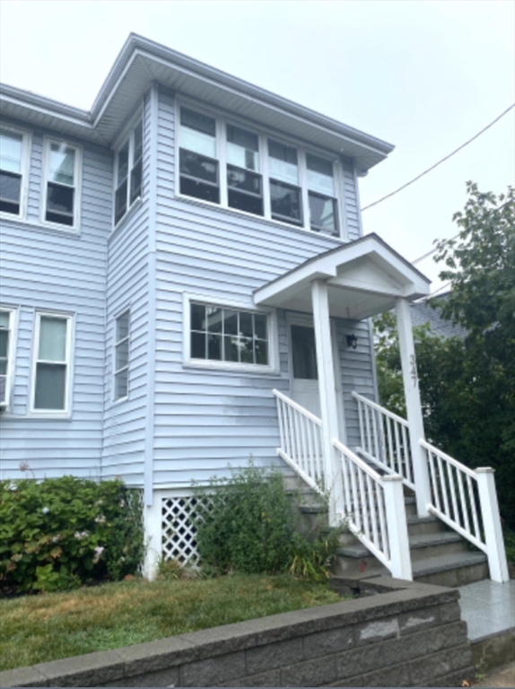 a front view of a house with a porch