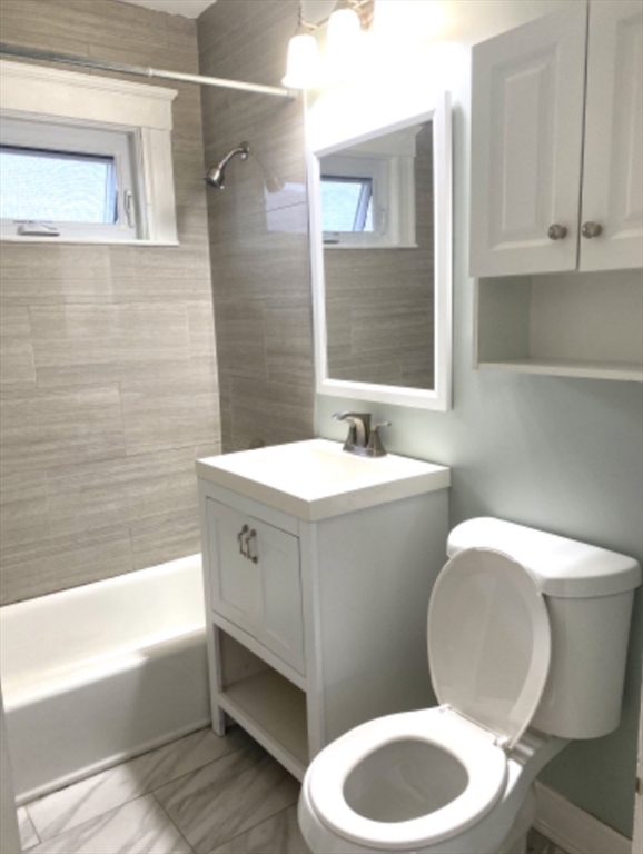 347 Vermont Street, Unit 2B Boston, MA 02132 - Photo 11 of 14 a bathroom with a sink a toilet and bathtub