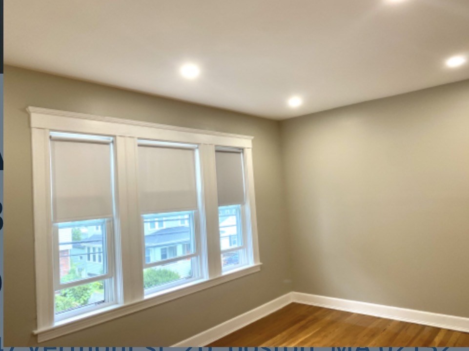 347 Vermont Street, Unit 2B Boston, MA 02132 - Photo 9 of 14 a view of empty room with wooden floor and fan
