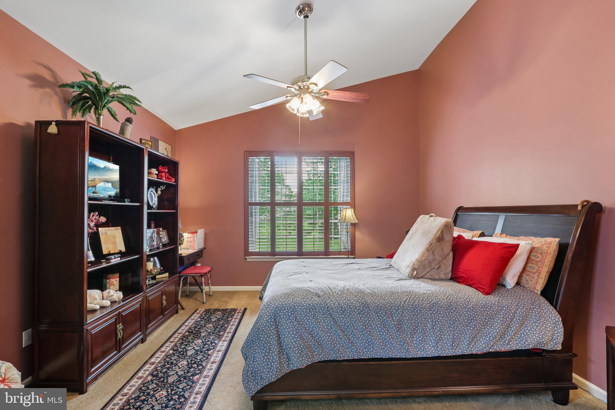39 Danbury Road Swedesboro, NJ 08085 - Photo 24 of 62 a bedroom with a bed furniture and a chandelier