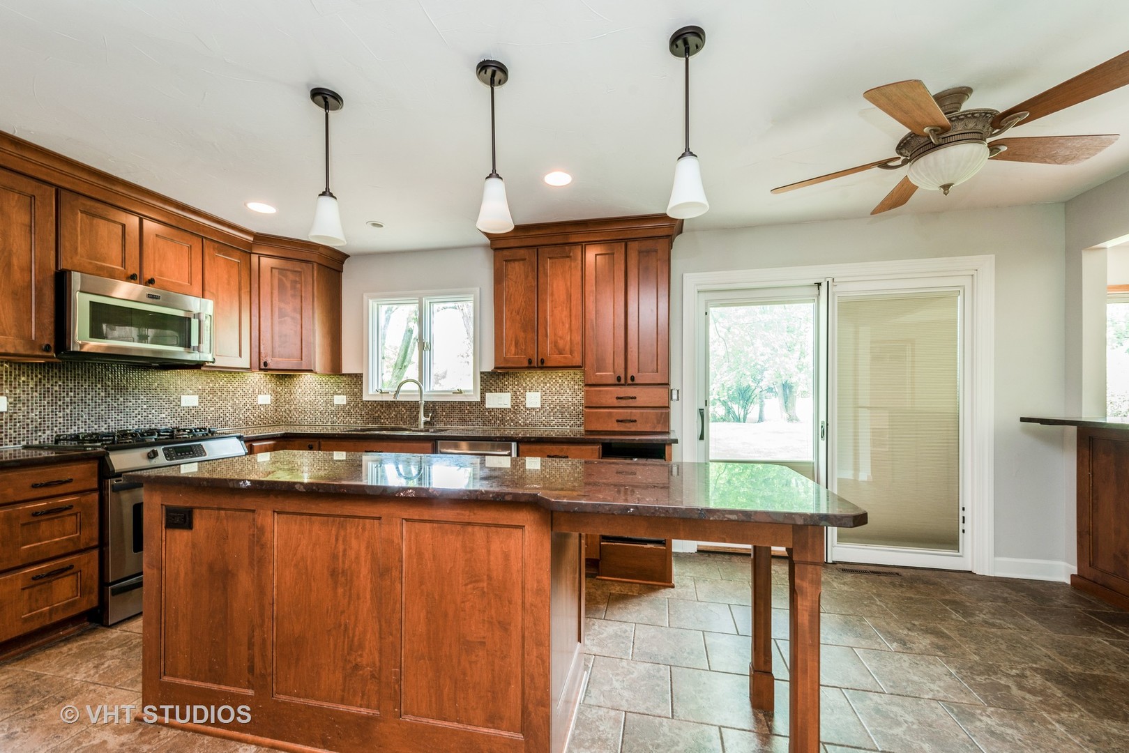 238 Valley Road Trout Valley, IL 60013 - Photo 6 of 41 a kitchen with stainless steel appliances granite countertop a sink a stove and a wooden floors