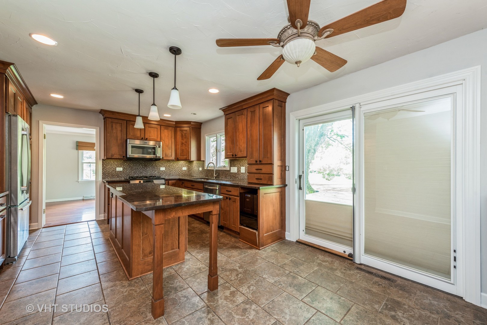 238 Valley Road Trout Valley, IL 60013 - Photo 7 of 41 a kitchen with stainless steel appliances kitchen island granite countertop a refrigerator and a sink