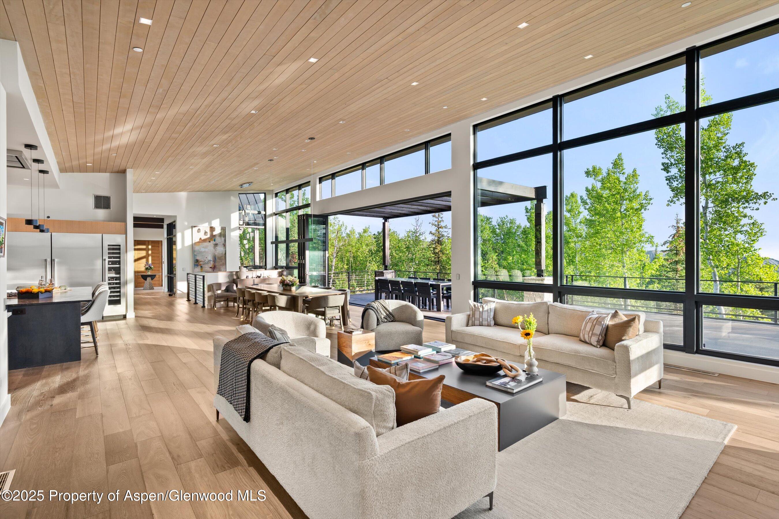 1234 Wood Road Snowmass Village, CO 81615 - Photo 19 of 66 a living room with furniture and a large window