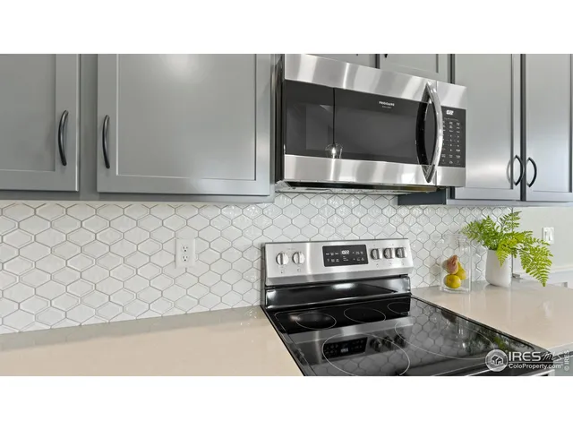 a kitchen with a stove and a microwave