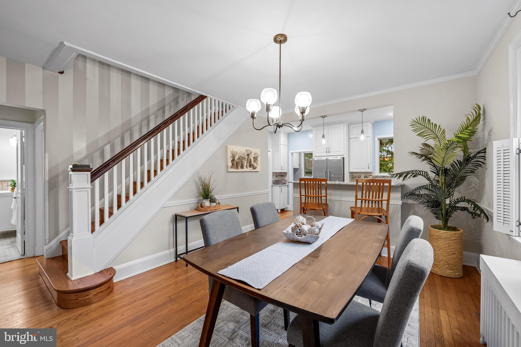 529 Overbrook Road Baltimore, MD 21212 - Photo 10 of 40 a view of a dining room with furniture a chandelier and wooden floor