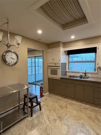 a kitchen with stainless steel appliances granite countertop a sink and cabinets