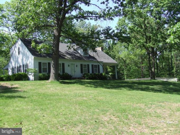 417 Mish Road Bunker Hill, WV 25413 - Photo 1 of 13 a front view of a house with a garden