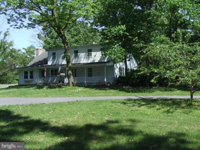 417 Mish Road Bunker Hill, WV 25413 - Photo 2 of 13 a front view of a house with a yard