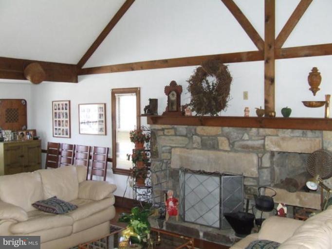 417 Mish Road Bunker Hill, WV 25413 - Photo 13 of 13 a living room with furniture and a fireplace