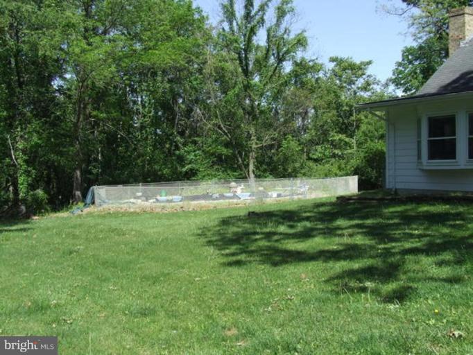 417 Mish Road Bunker Hill, WV 25413 - Photo 5 of 13 a view of a house with a backyard