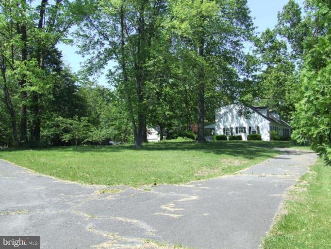 417 Mish Road Bunker Hill, WV 25413 - Photo 7 of 13 a view of a house with a yard and large trees