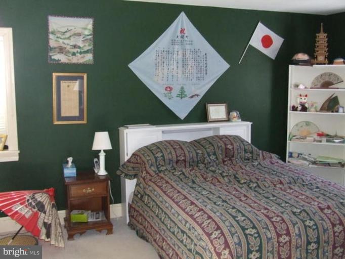 417 Mish Road Bunker Hill, WV 25413 - Photo 8 of 13 a bedroom with a bed and a painting on the wall