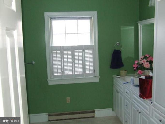 417 Mish Road Bunker Hill, WV 25413 - Photo 9 of 13 a kitchen with a refrigerator and a window