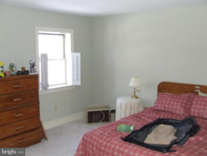 417 Mish Road Bunker Hill, WV 25413 - Photo 10 of 13 a bedroom with a bed and a dresser