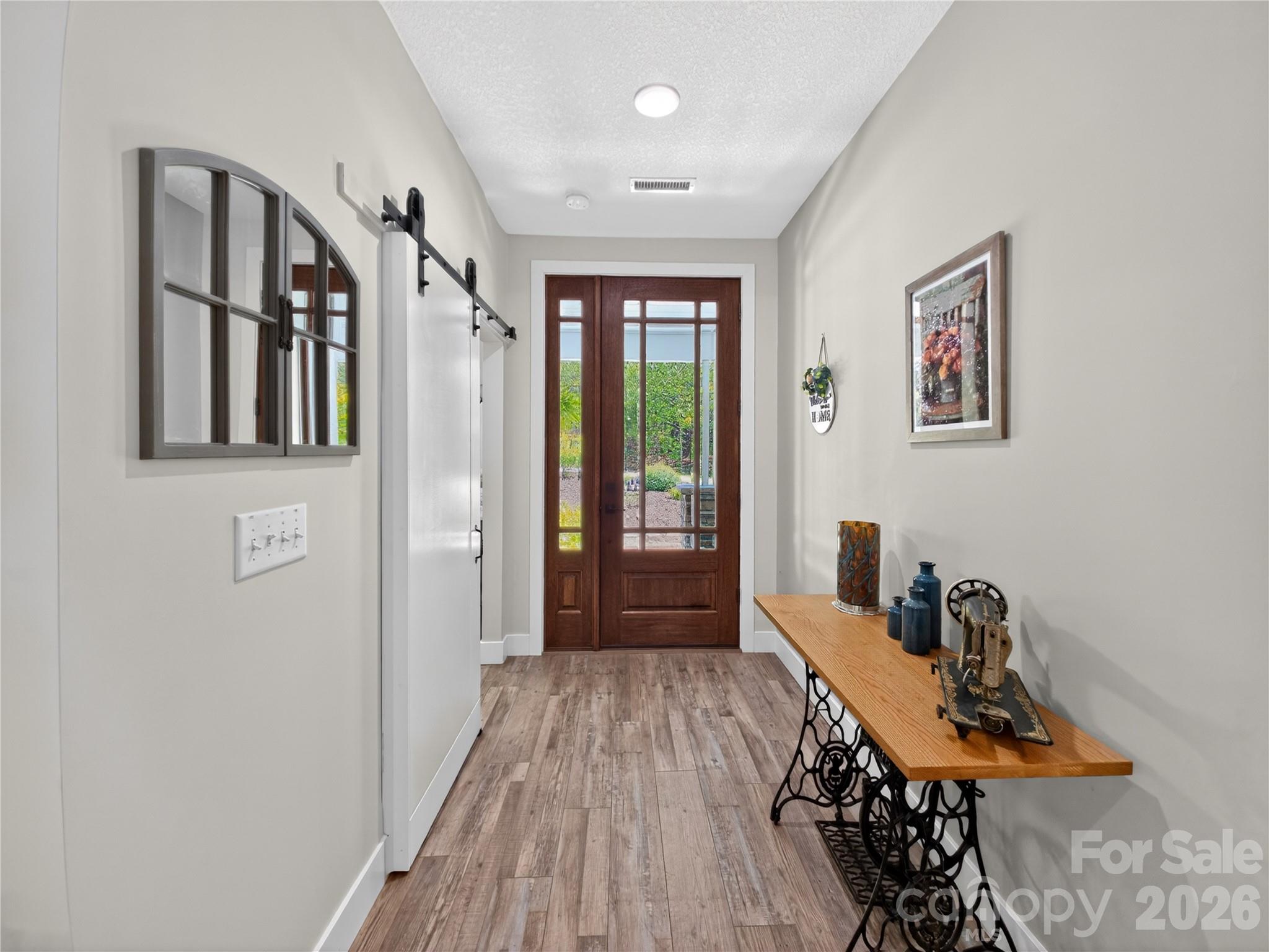 278 Hunters Trace Rutherfordton, NC 28139 - Photo 16 of 33 a view of a hallway with workspace and wooden floor